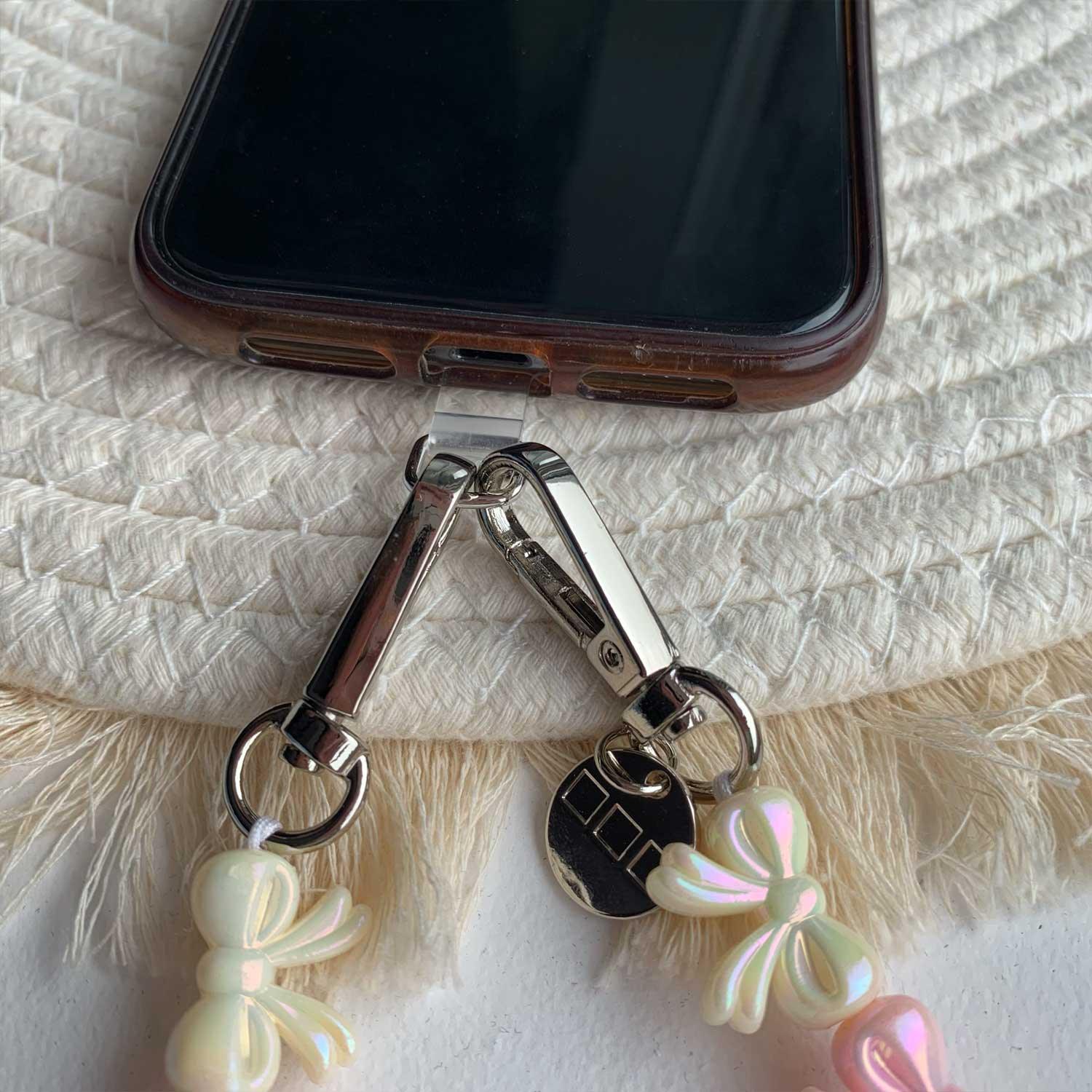 Telefoonkoord Bow - lichtroze wit - zilver